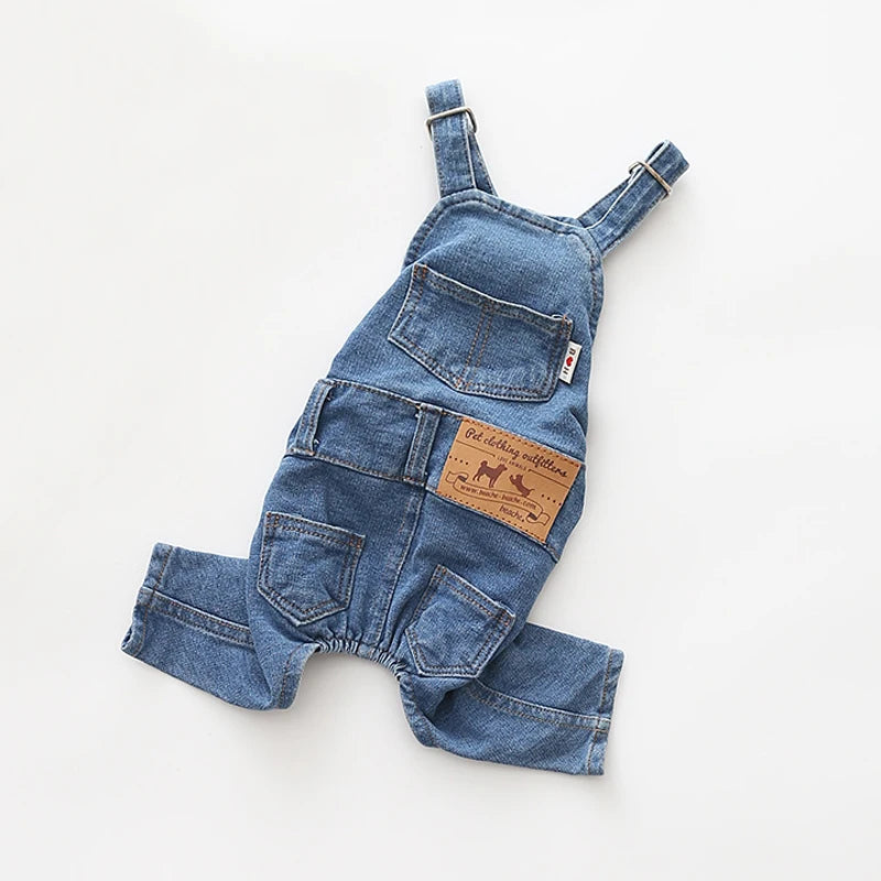 A denim jumpsuit costume for a dog, featuring pockets and straps.