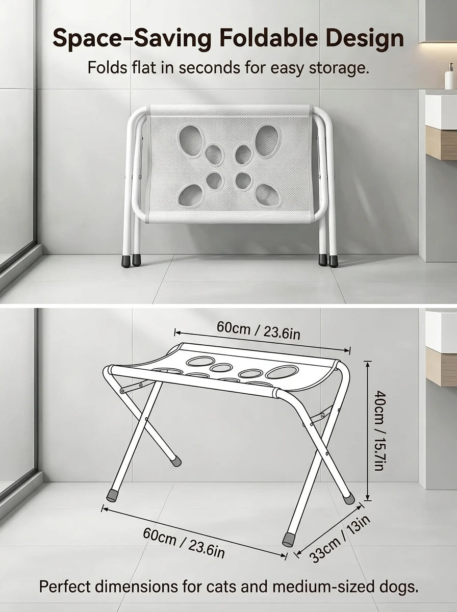 A white space-saving foldable pet grooming hammock station with a perforated surface shown in a modern bathroom setting.