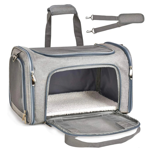 A gray collapsible soft-sided pet carrier for cats and small dogs with a handle and carrying strap.