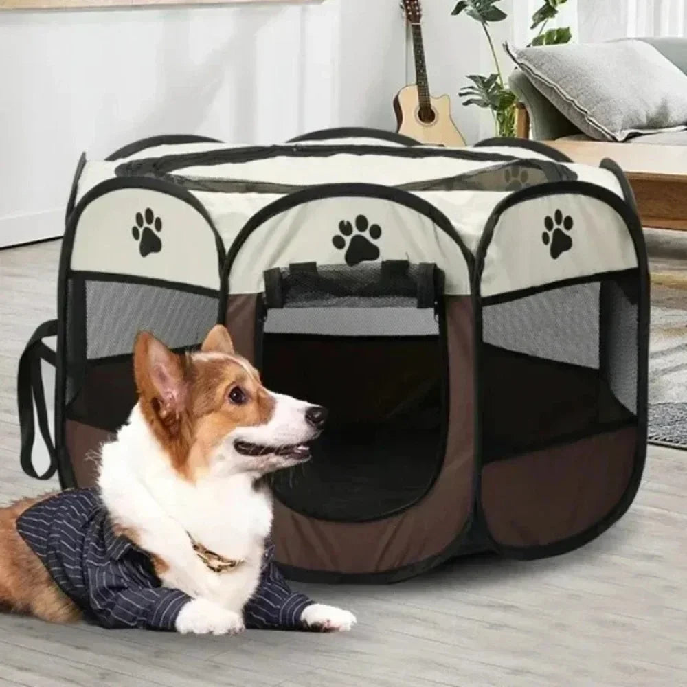 A small dog is sitting inside a portable foldable pet tent and playpen with a black and gray fabric design.