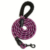 A black reflective dog leash with a padded handle coiled and attached to a metal clip.