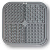 A gray silicone pet licking mat with suction cups designed for slow feeding of dogs and cats.