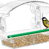 Clear acrylic window bird feeder with a green tube and suction cups for feeding birds.