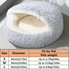 A gray plush pet bed nest with a white lining shown on a wooden surface.
