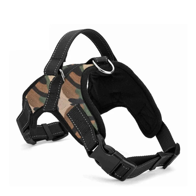 A black dog harness with camouflage patterned fabric, featuring a handle and adjustable straps.