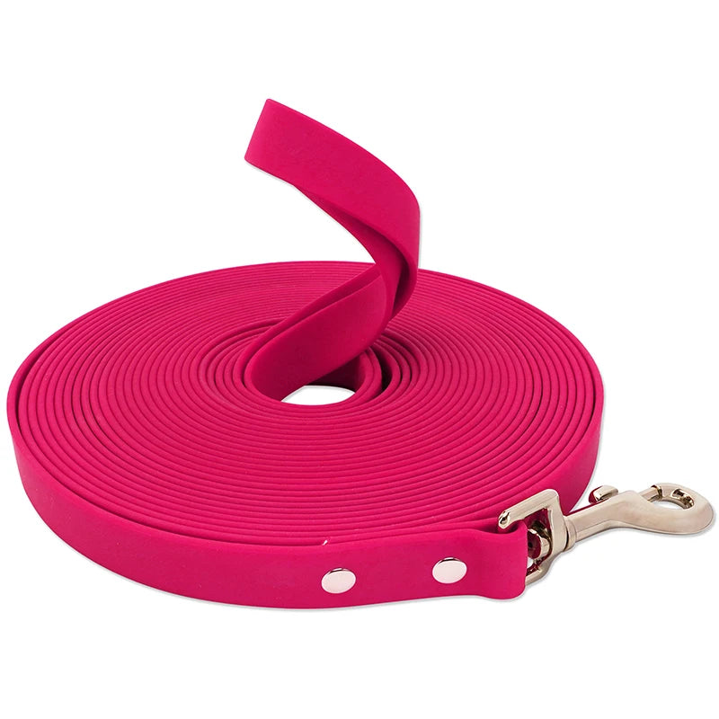 A bright pink heavy-duty waterproof dog leash coiled and displayed on a white background.