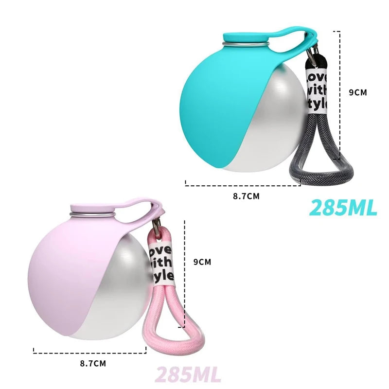 A portable stainless steel dog water bottle with a built-in bowl shown in teal and pink colors.