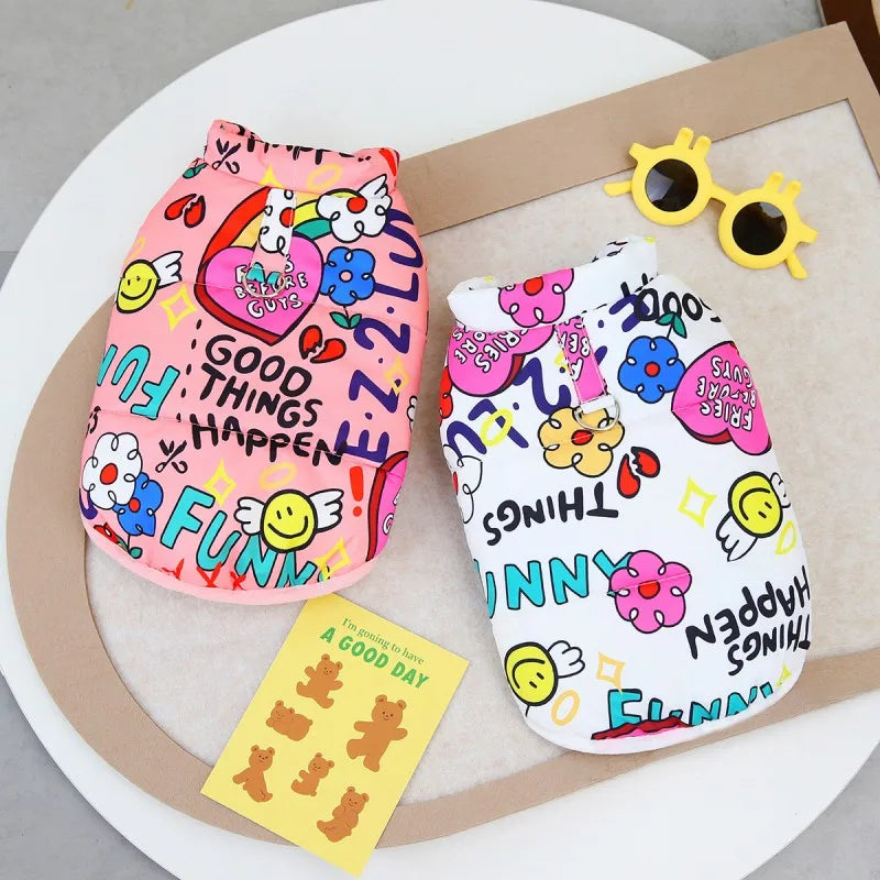 Pink and white patterned waterproof dog coat with a yellow sunglasses accessory displayed on a neutral background.