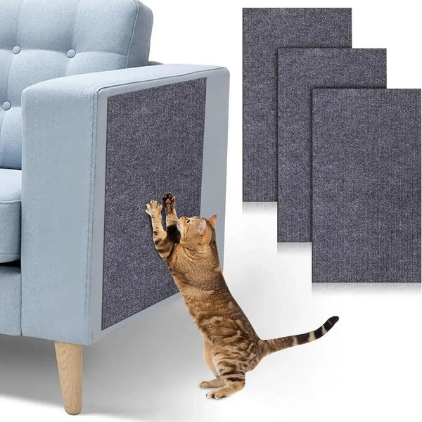 A tabby cat jumps onto a blue upholstered furniture pad, which is designed to protect the furniture.