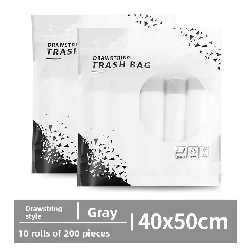 Packaged drawstring trash bags in gray with handles, showing a roll of 200 pieces.