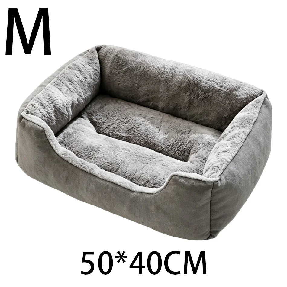 A gray plush pet bed with a rounded, cushioned design shown from above.