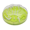 A clear plastic puzzle maze slow feeder bowl with green and white components for pets.