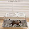 A stainless steel cat litter box with a clear top and a large space for cats is shown on a wooden floor.