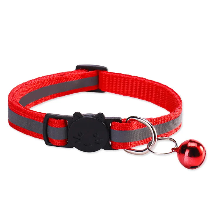 Red and gray reflective nylon pet collar with a black charm and a shiny red bell attached.