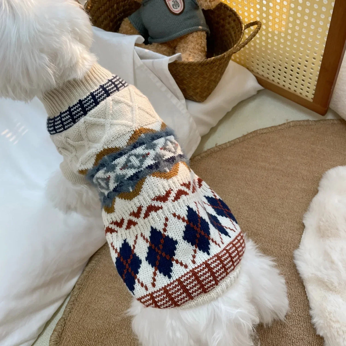 A cozy knit pet sweater for dogs and cats featuring geometric patterns in beige, blue, and brown tones.