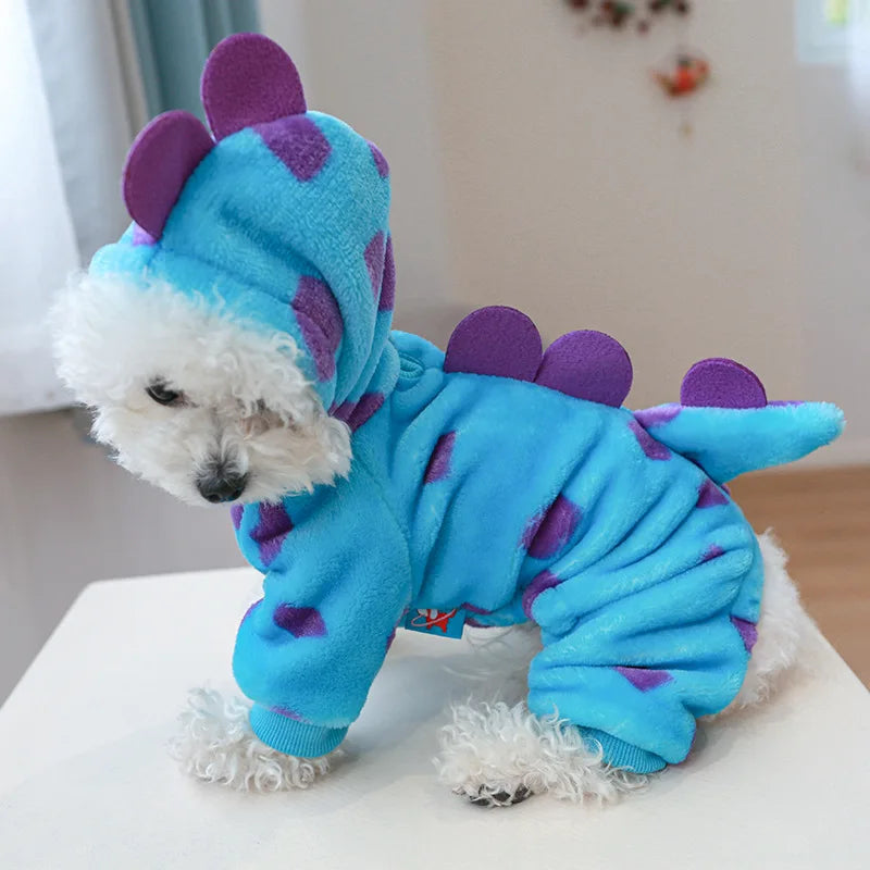 A blue plush fleece pet overalls with purple accents and a white fluffy face.