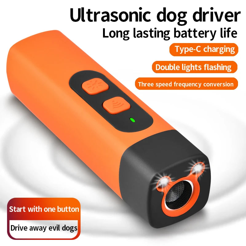 Orange ultrasonic dog driver device with a black body and an illuminated lens.