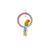 A yellow parrot is perched on a pink cotton rope perch with a small star charm.