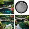 A black floating plant barrier ring is shown in a natural garden setting with lush greenery and water features.