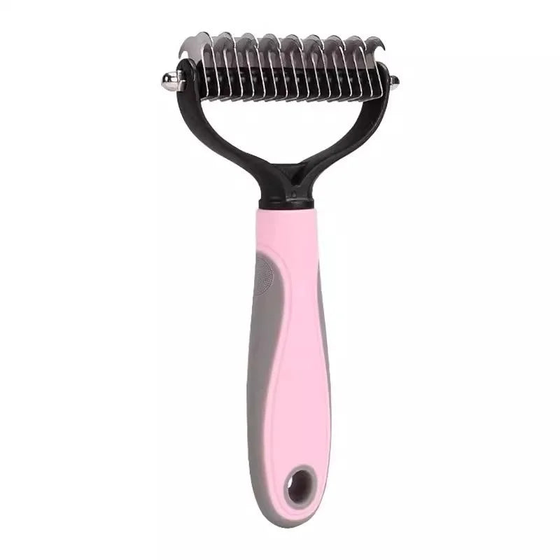 A pink stainless steel pet deshedding comb with black handles.
