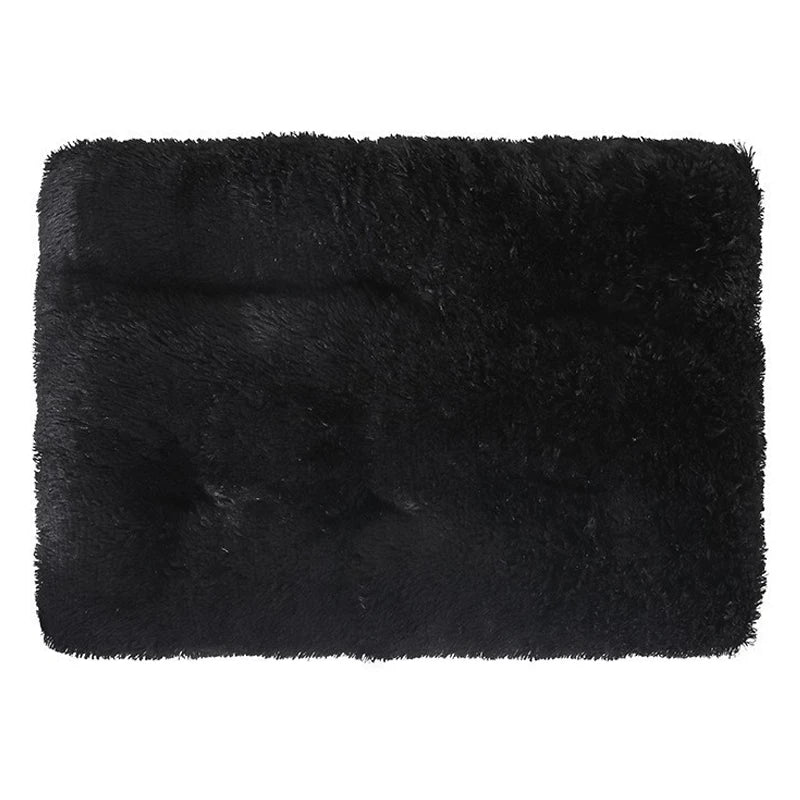 Black plush pet bed mat with a non-slip base