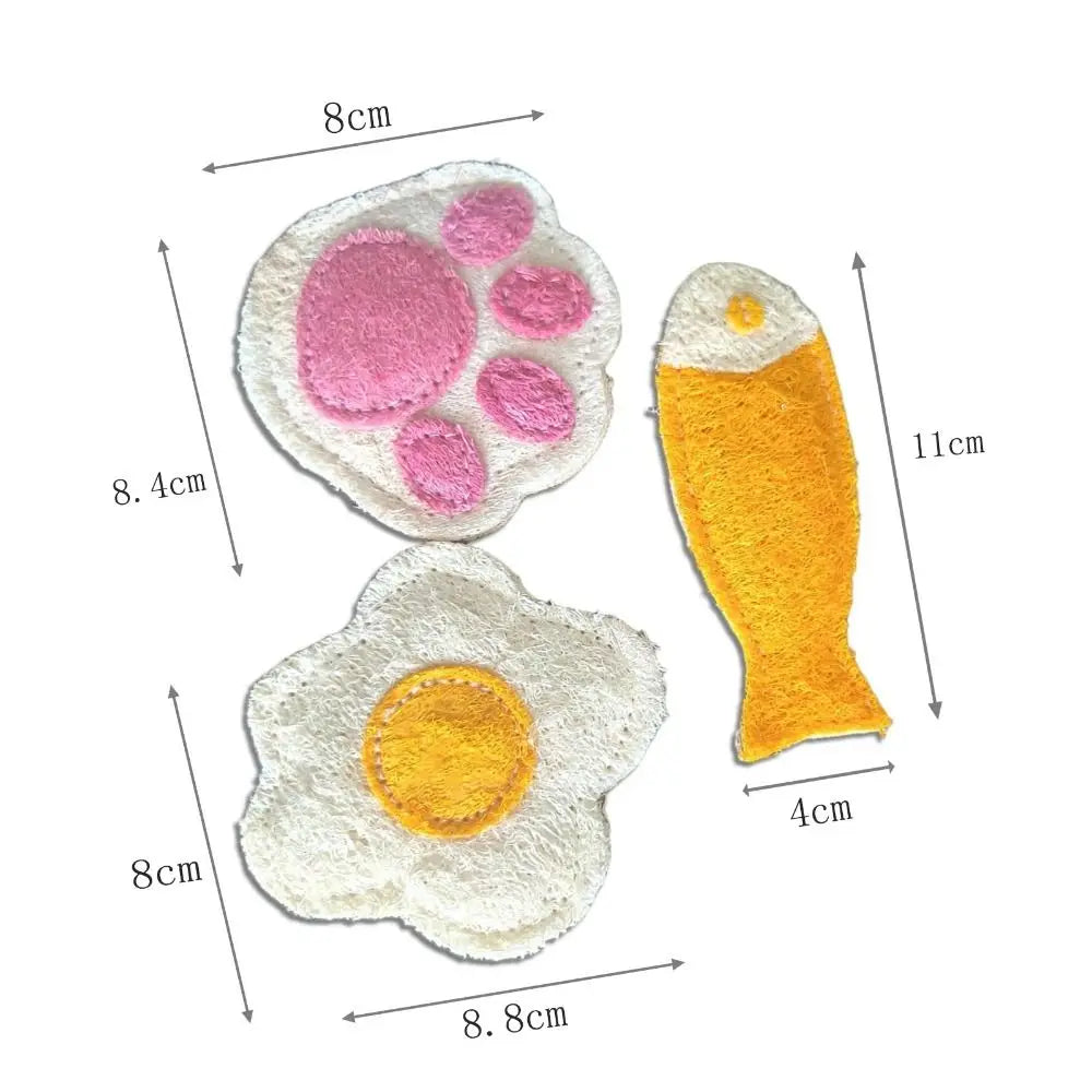 A set of natural loofah cat chew toys, including a pink paw print and an orange fish shape.