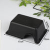 A black reptile hide box enclosure with a slightly curved shape is shown on a white surface.