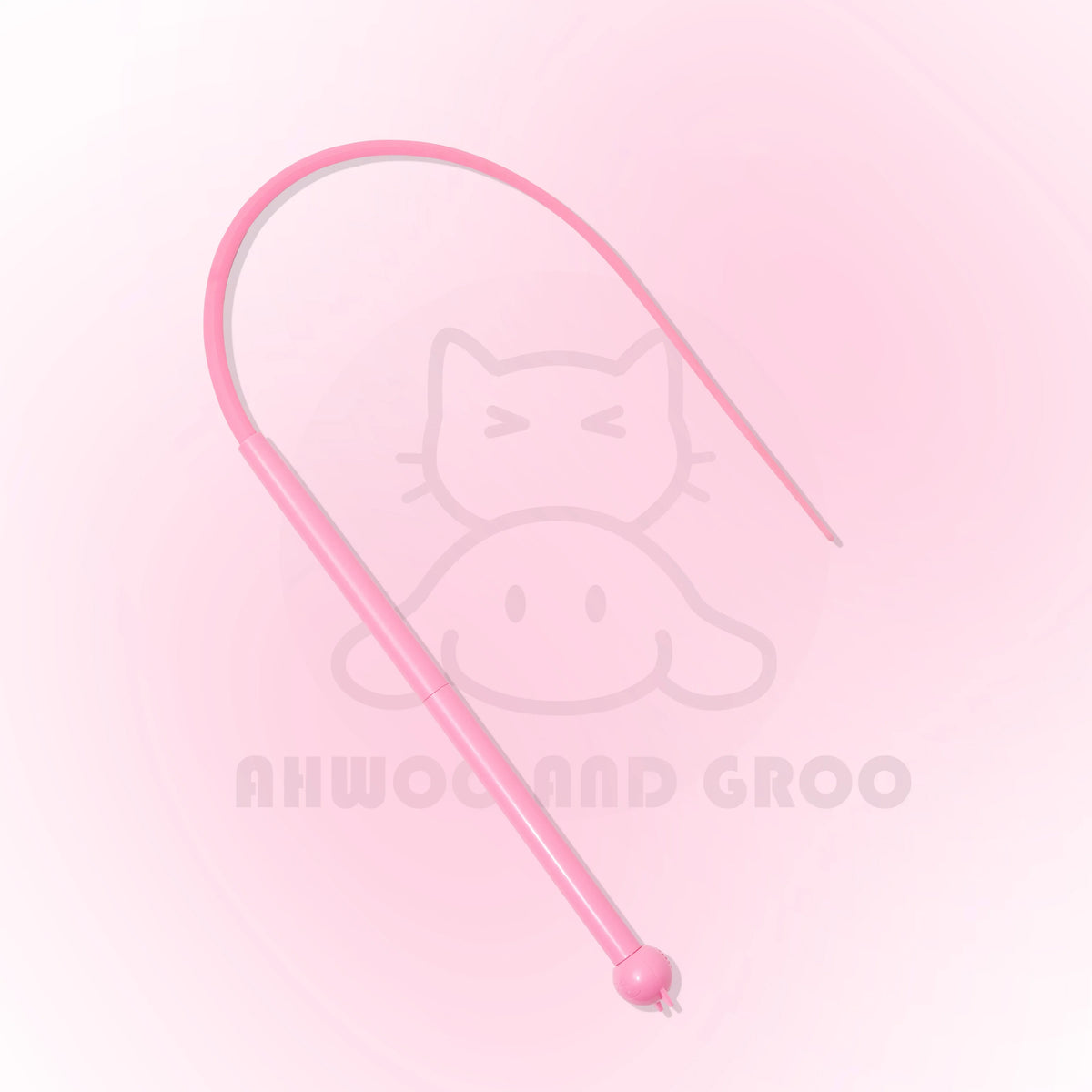 A pink interactive cat teaser wand with a silicone tail and bell against a light pink background.