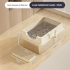 A large heightened khaki semi-enclosed cat litter box with a grated floor visible on a wooden floor.