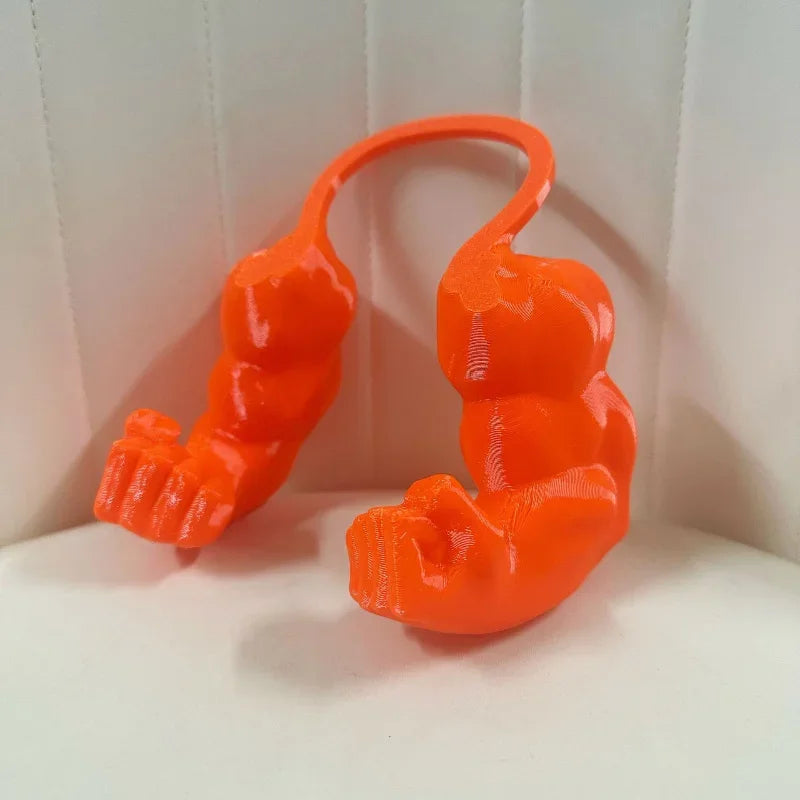 An orange 3D printed cat muscle arm accessory shaped like a crouching feline.