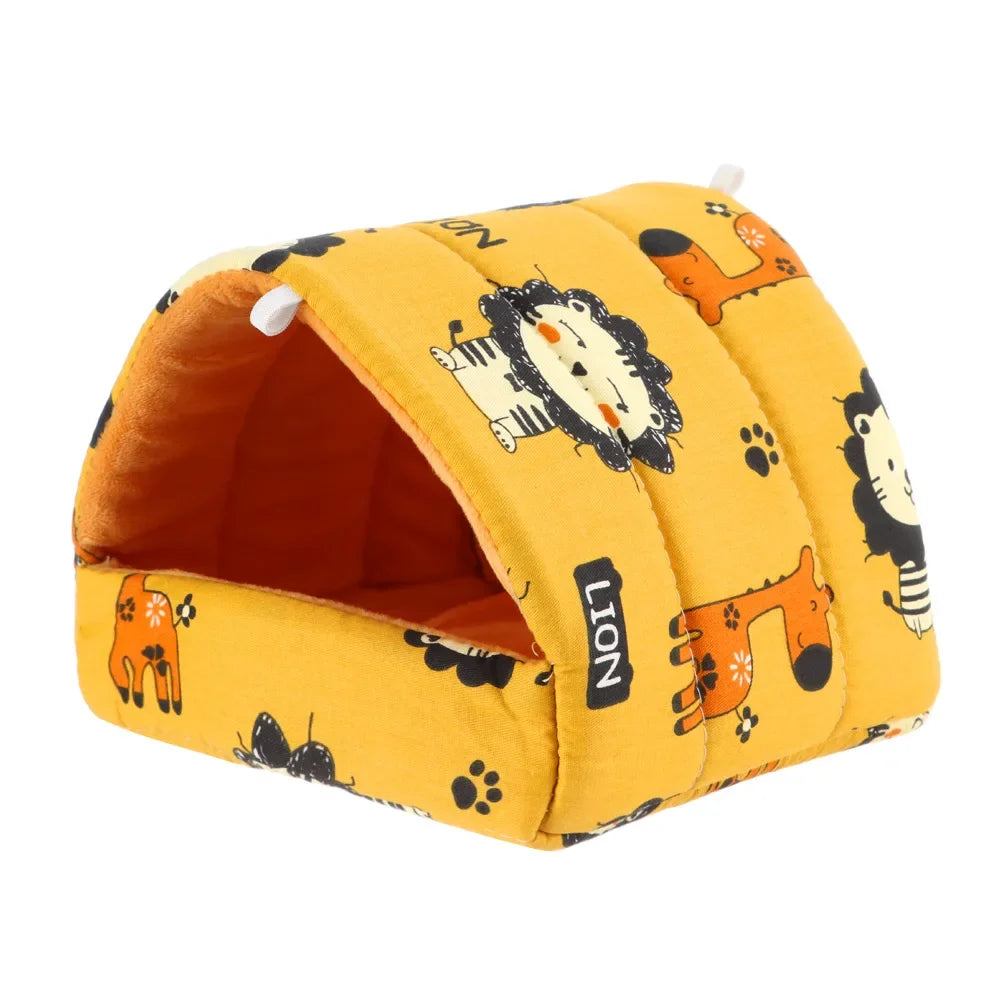 A yellow flannel pet nest bed shaped like a lion with orange and black paw prints.
