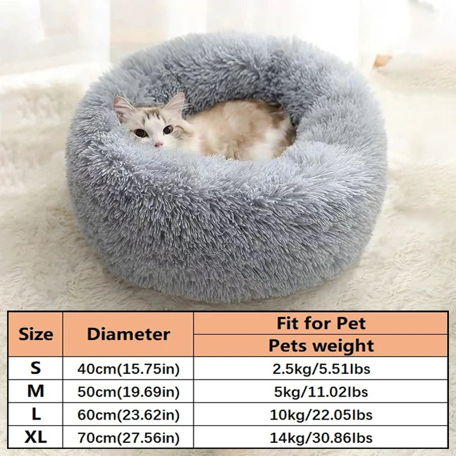 A gray fluffy pet bed shaped like a donut, suitable for small to medium pets.
