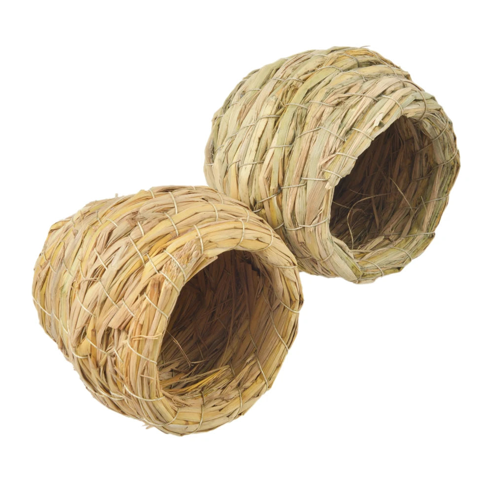 A handmade natural straw bird nest with a woven, cylindrical shape.