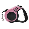 Pink and black retractable dog leash with a comfortable grip and three visible markings.