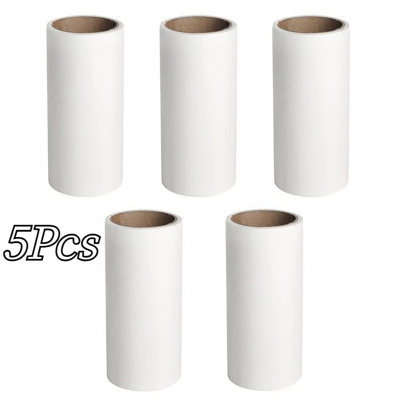 Five white mini lint rollers with replaceable adhesive paper.