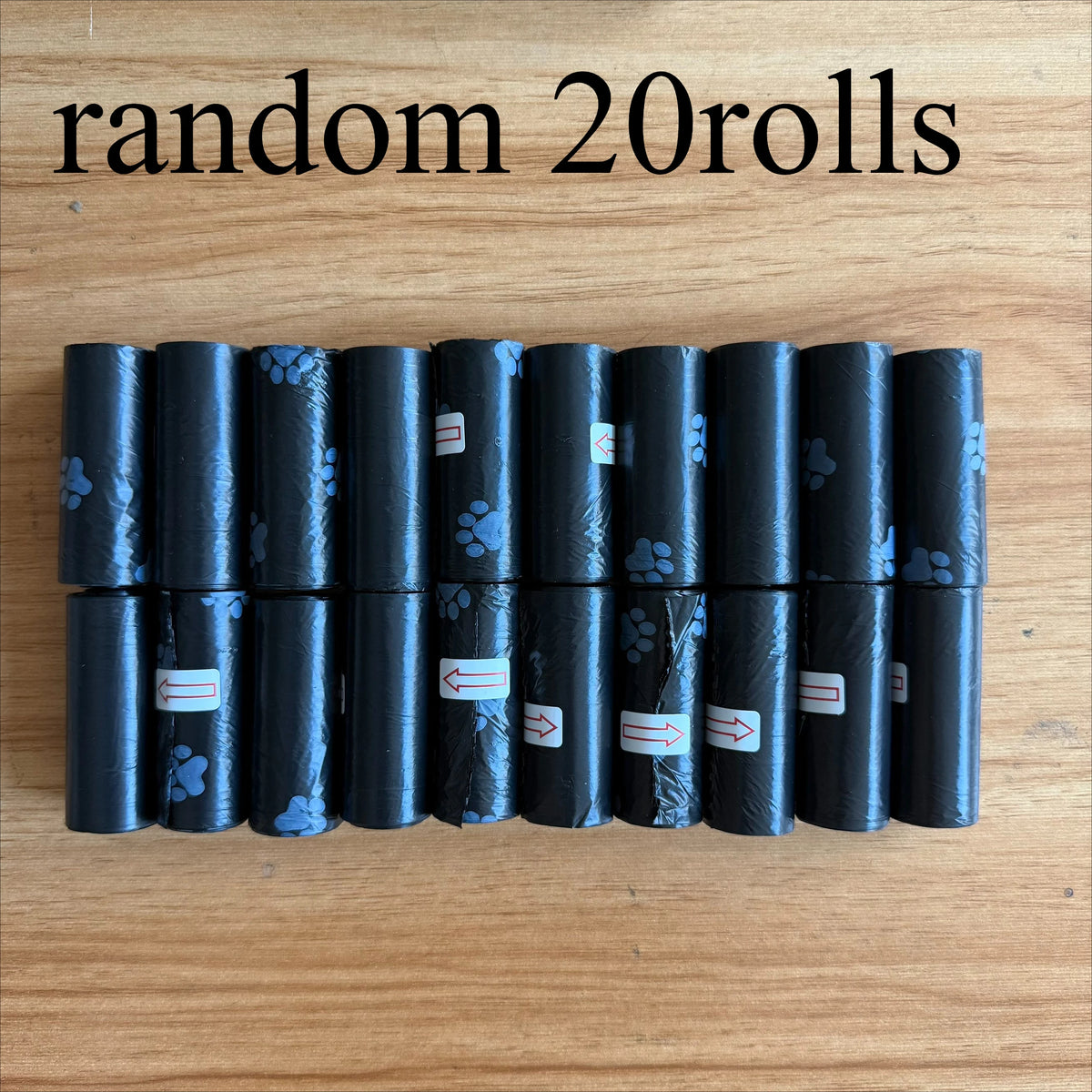 A row of twenty black leak-proof dog waste bags in rolls, featuring a paw print design.