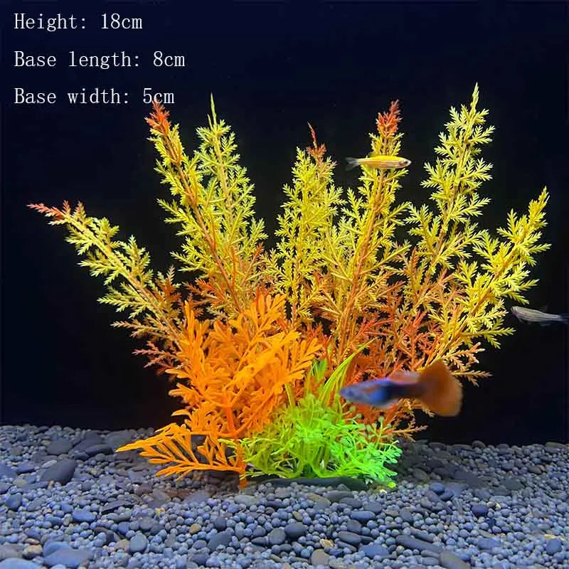 A vibrant artificial aquarium plant with yellow and orange foliage is displayed on a gravel substrate.