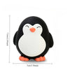 A cute penguin dog toy with black and white coloring and orange feet.