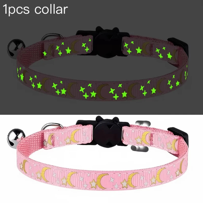 A pink glow-in-the-dark collar featuring a cat and dog design with a bell.