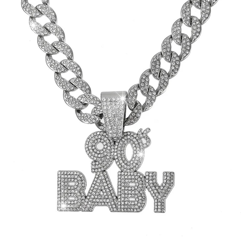 A silver iced out letter and animal pendant Cuban link chain necklace