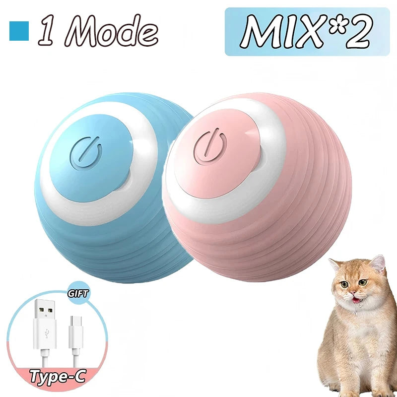 Zwei rosa und blaue interaktive rollende Katzenspielzeuge neben einer Katze mit einem Type-C-Kabelzubehör.