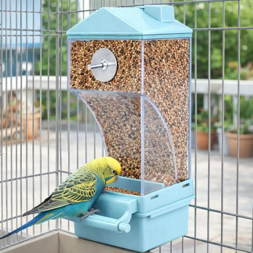 A light blue automatic bird feeder with a clear dome and a feeding tray is visible inside a metal cage.