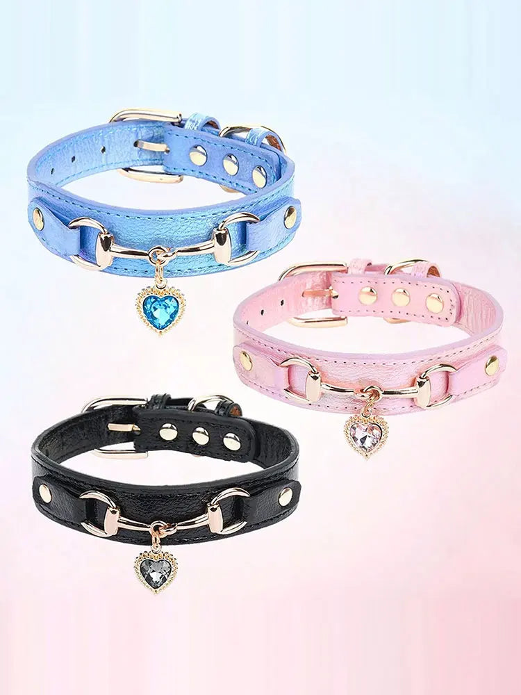 Three gemstone-embellished PU leather dog collars in blue, pink, and black.