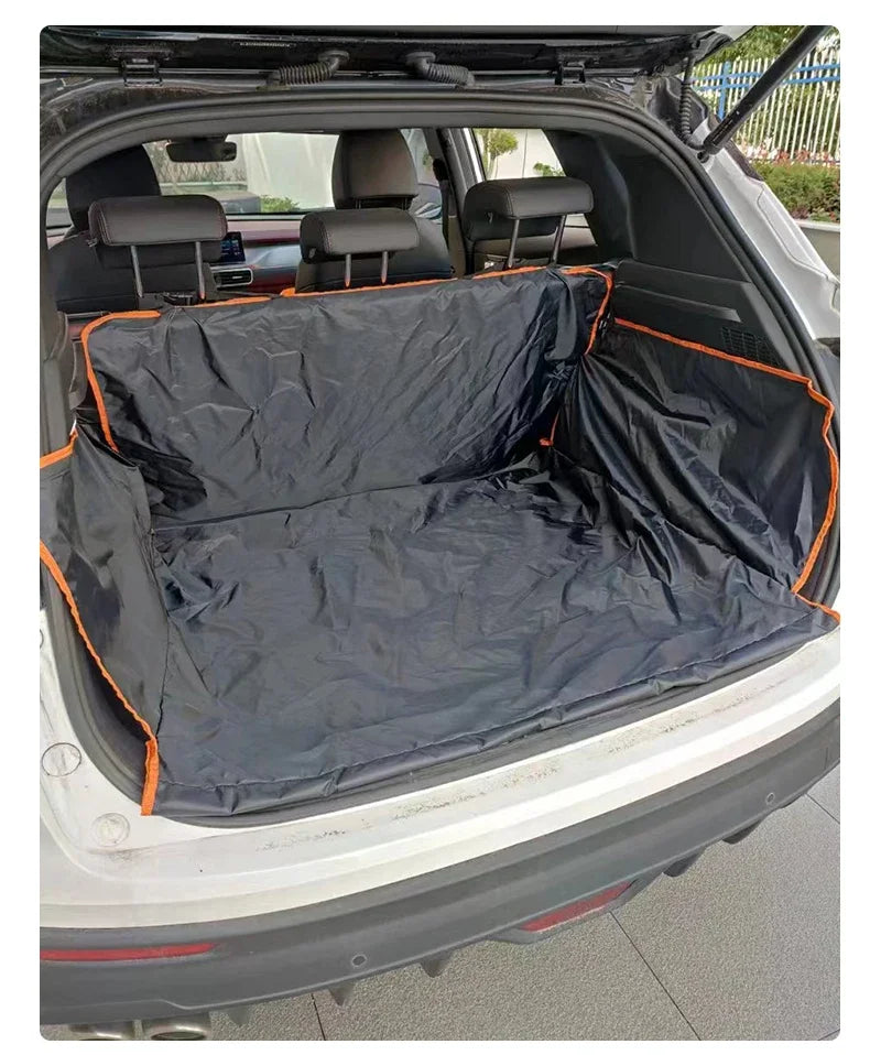 A black waterproof cargo liner for a vehicle, shown inside the trunk with seat covers installed.