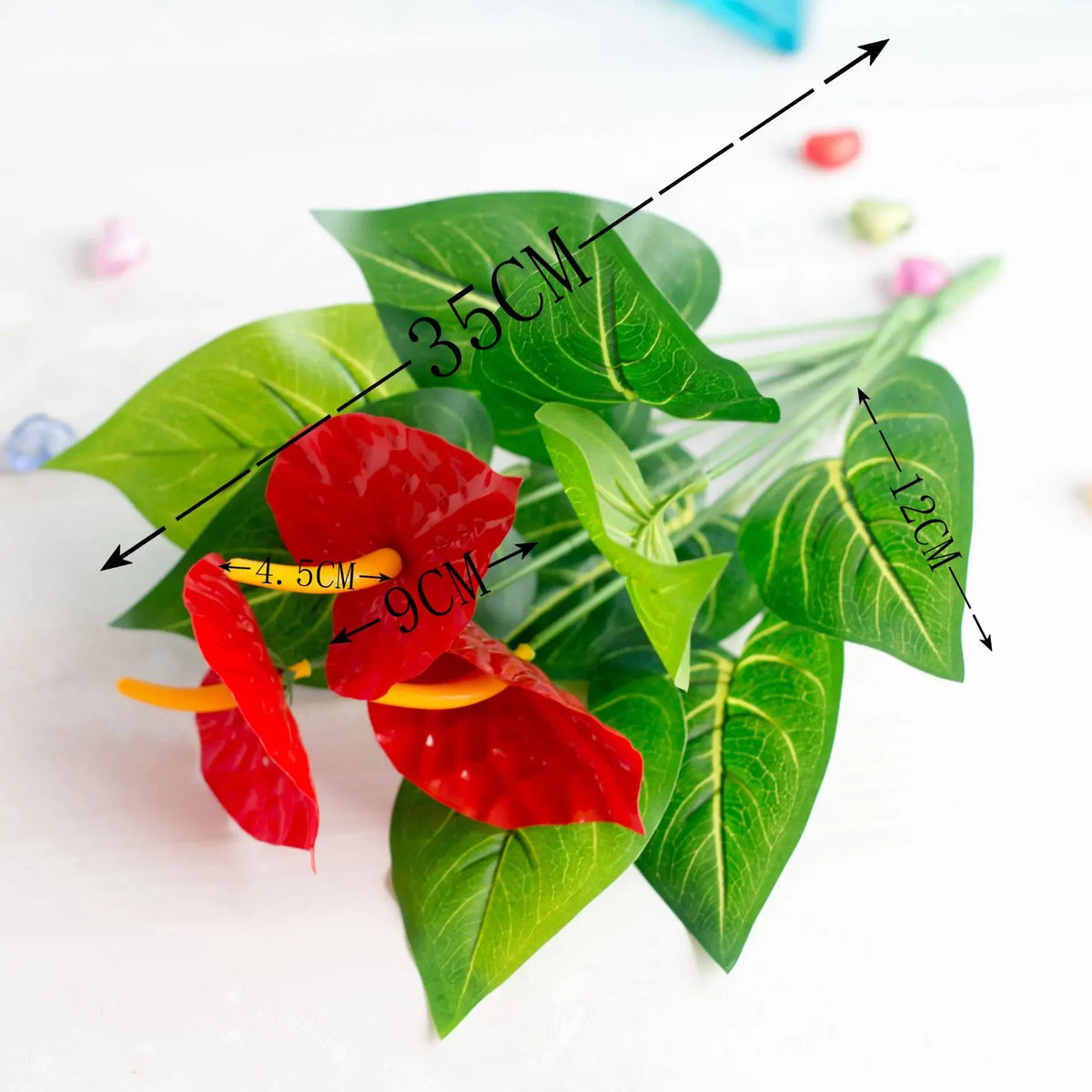 Artificial Anthurium fake plant with red leaves and yellow accents shown with dimension lines.