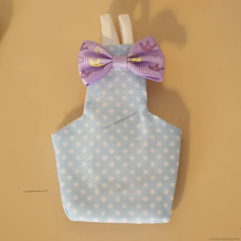 A light blue parrot flight suit with a purple bow tie displayed against a neutral background.