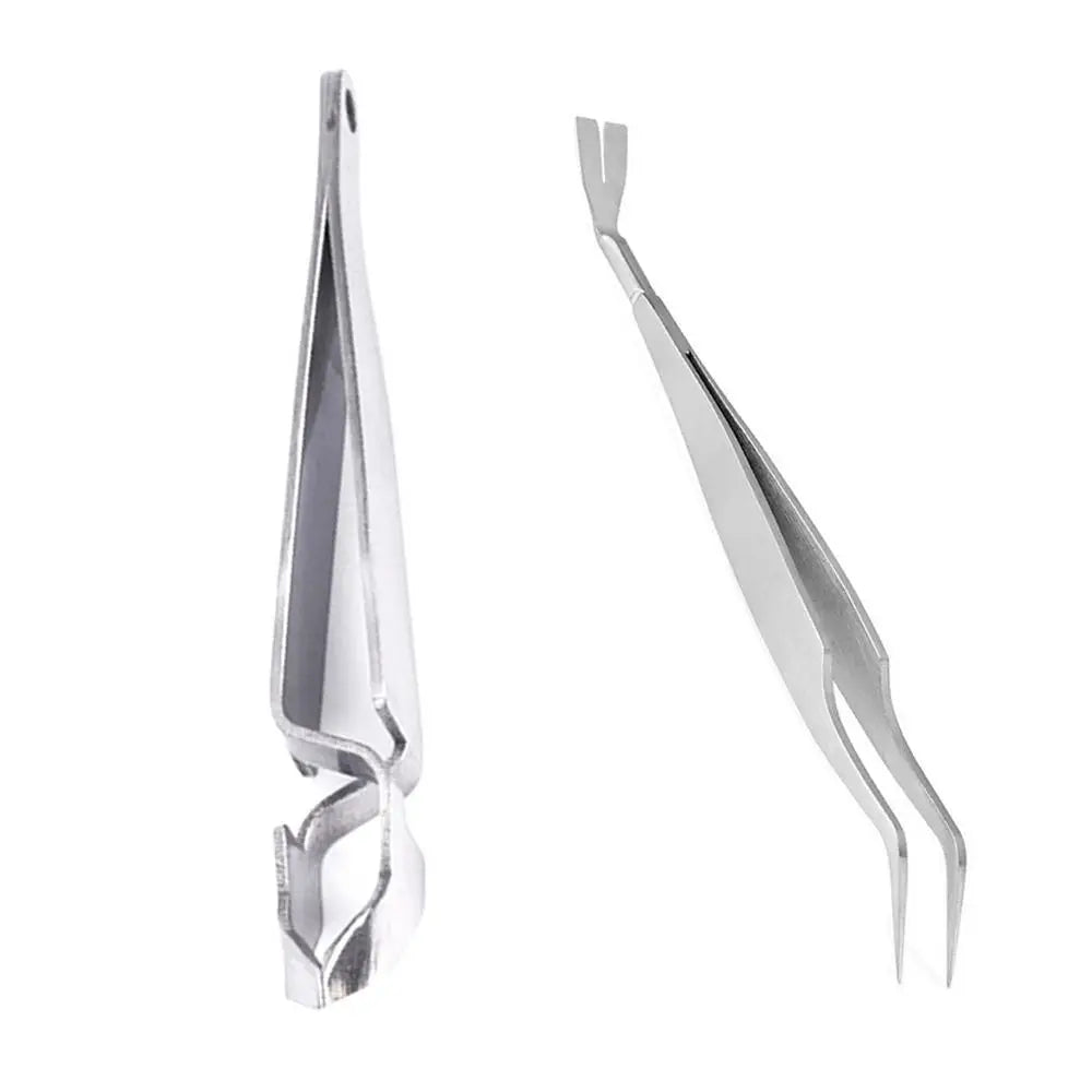 A set of three stainless steel tick remover hooks used for pets.