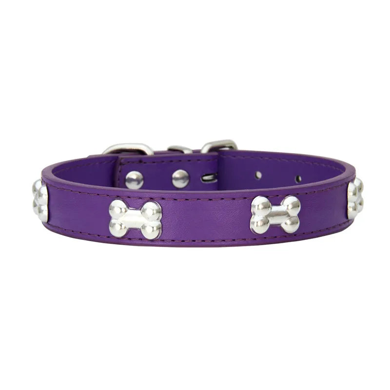A purple leather dog collar with silver hardware.