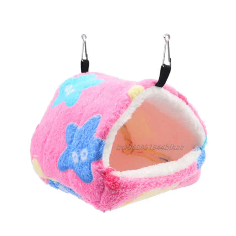 Pink fleece pet nest bed with blue star accents and hanging loops