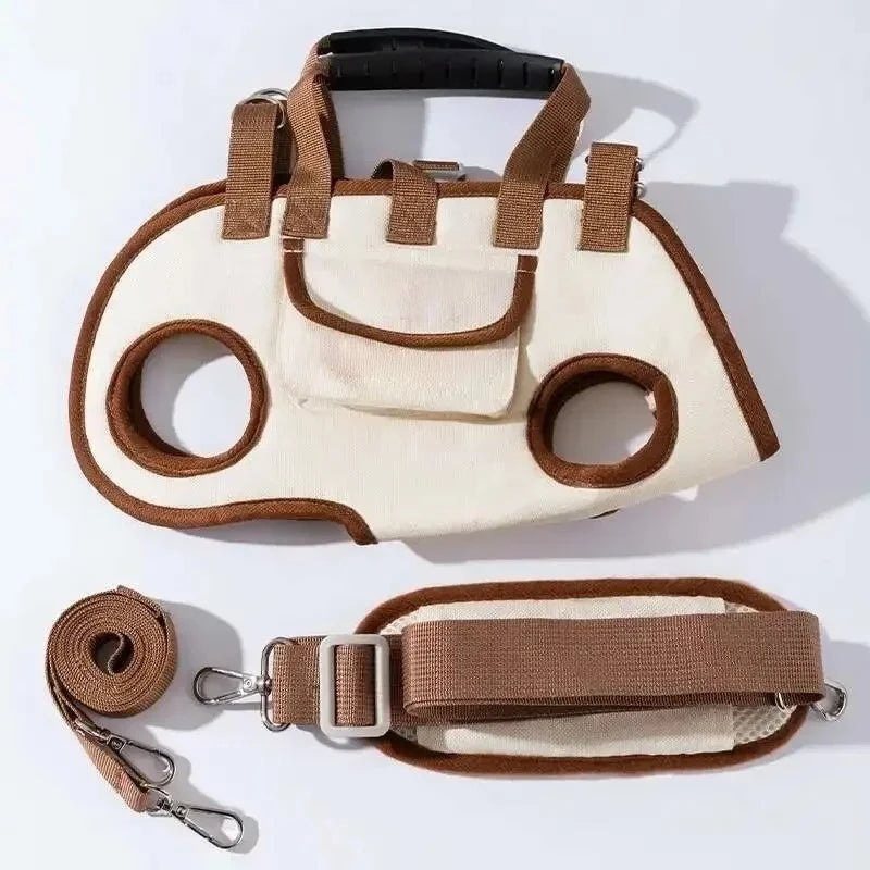 A beige and brown portable pet carrier sling bag with an adjustable shoulder strap.